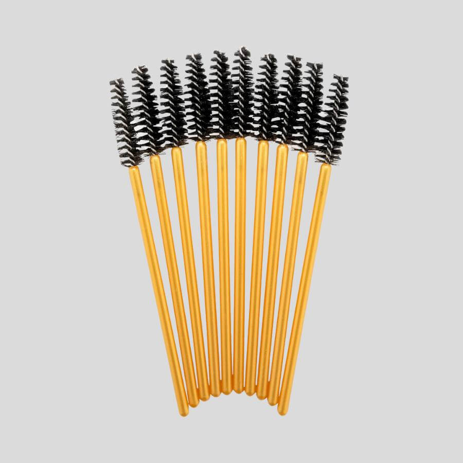 Gupillón dorado y negro ideal para el cuidado de extensiones de pestañas.